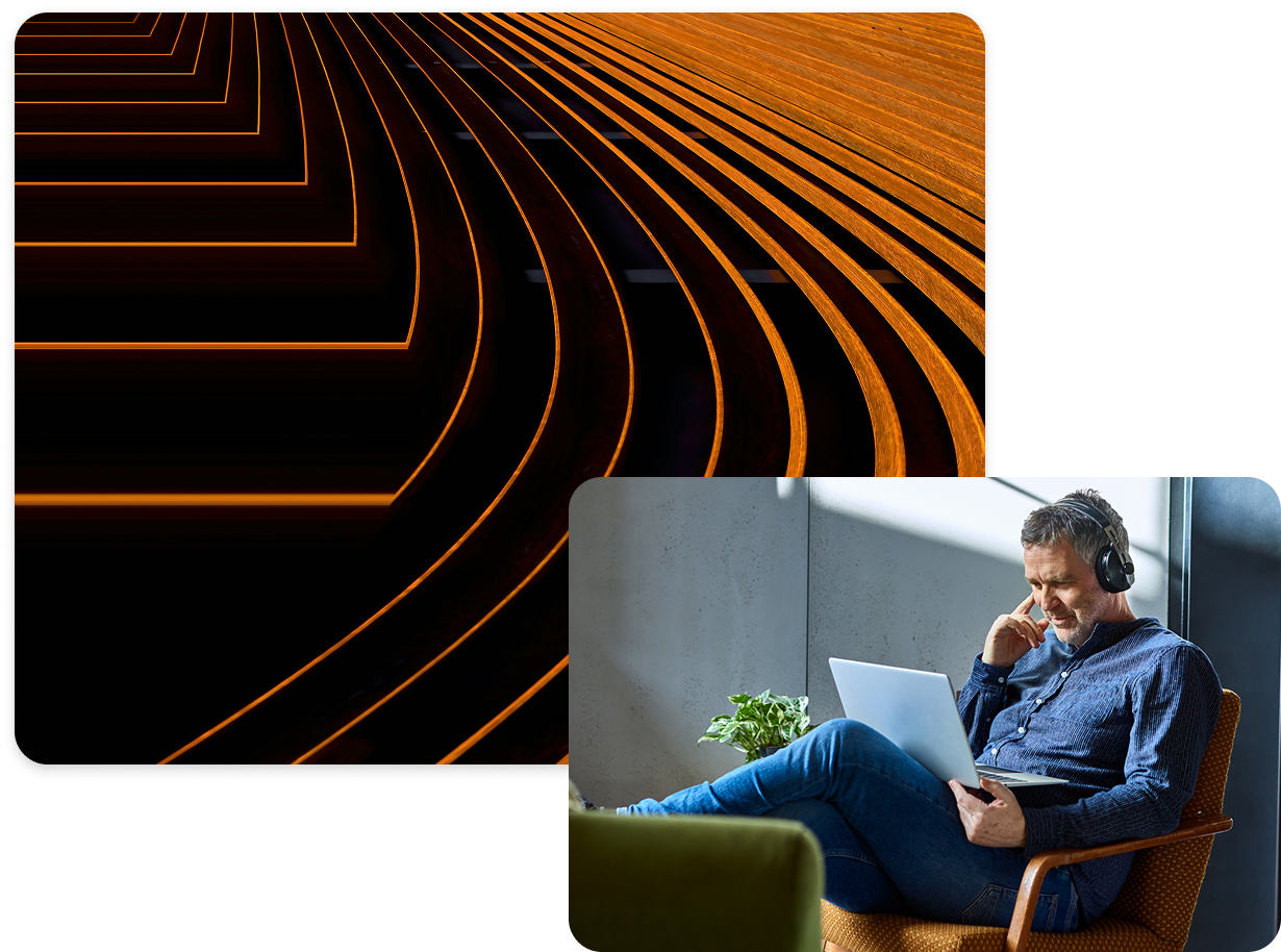Man sitting on chair and looking at laptop